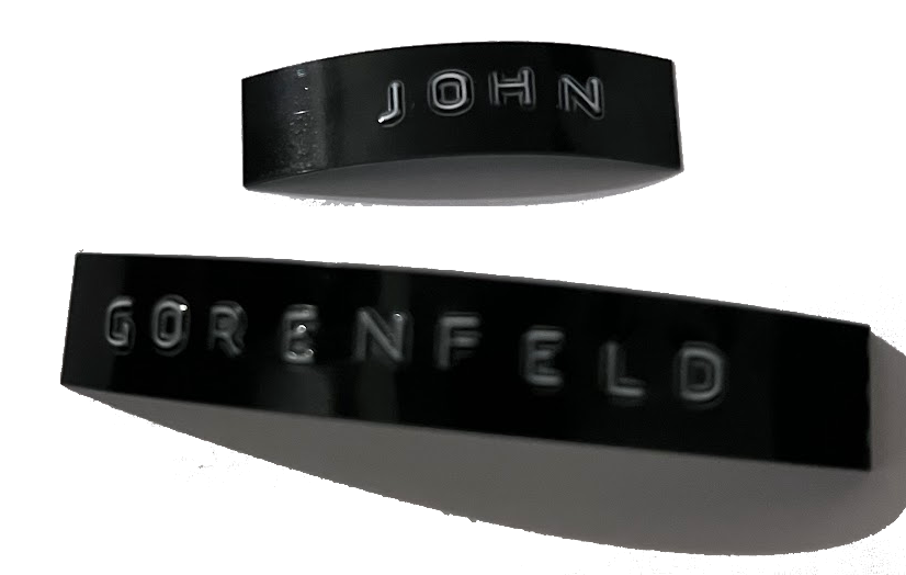 john gorenfeld's name 
as an 
old school embossed label